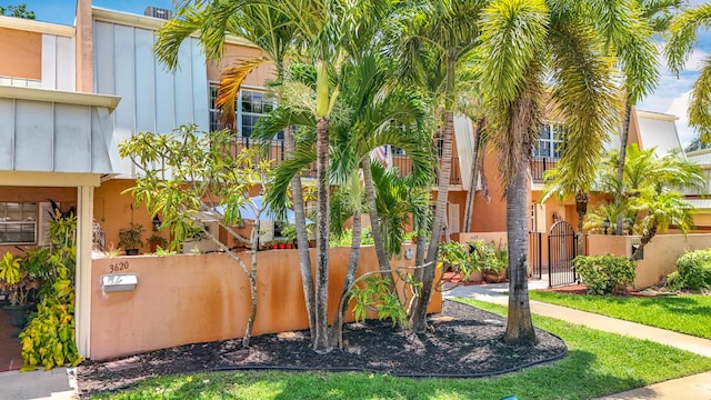 3622 Citrus Trce Unit 2, Davie, FL 33328 - surrounding community with a gate and a fenced front yard