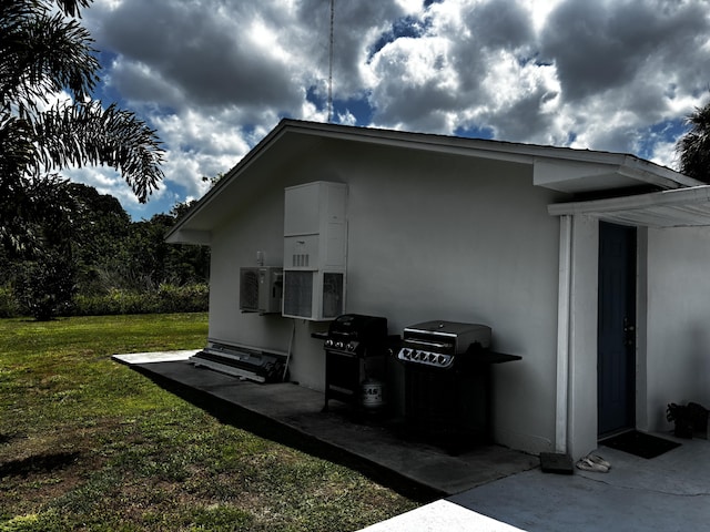 1210 Hartman Rd, Fort Pierce, FL 34947 - view of home's exterior featuring a yard and stucco siding