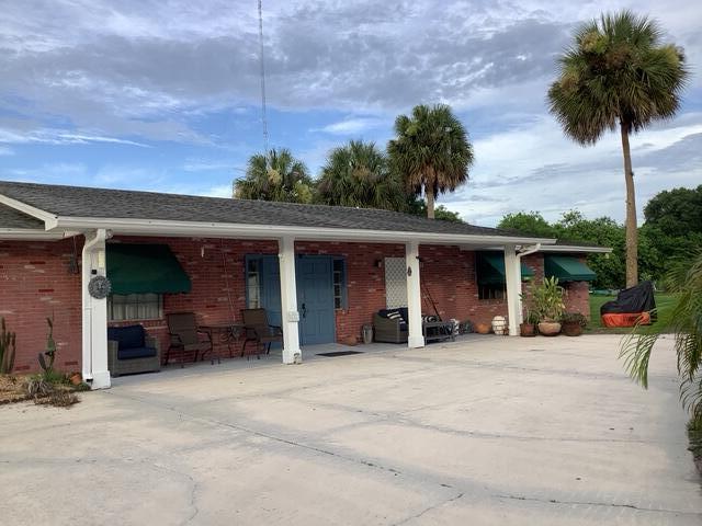 1210 Hartman Rd, Fort Pierce, FL 34947 - view of parking / parking lot with concrete driveway
