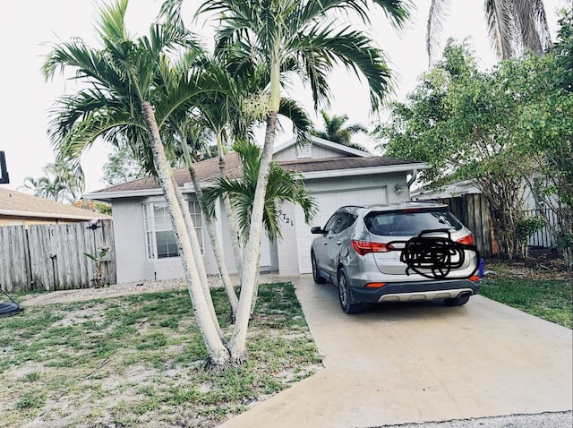 5721 Boynton Cres, Boynton Beach, FL 33437 - view of home's exterior featuring an attached garage and driveway