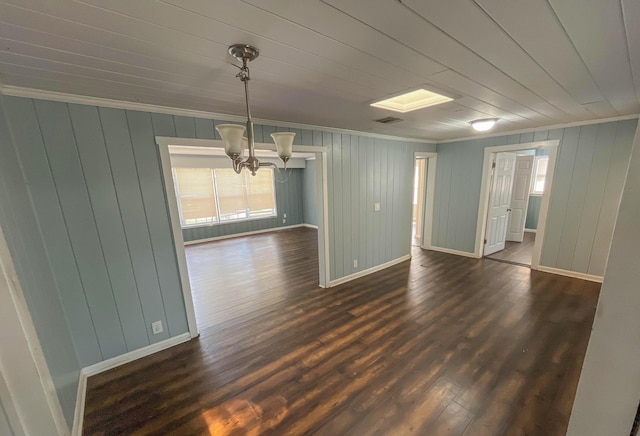 2818 Alabama St, West Palm Beach, FL 33406 - unfurnished room with crown molding, a chandelier, baseboards, dark wood-style floors, and wooden walls