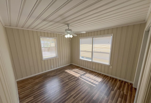2818 Alabama St, West Palm Beach, FL 33406 - unfurnished room featuring dark wood finished floors, baseboards, ceiling fan, and wooden walls