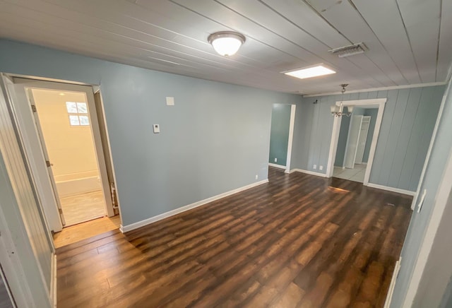 2818 Alabama St, West Palm Beach, FL 33406 - empty room featuring dark wood-style floors, baseboards, and wood ceiling