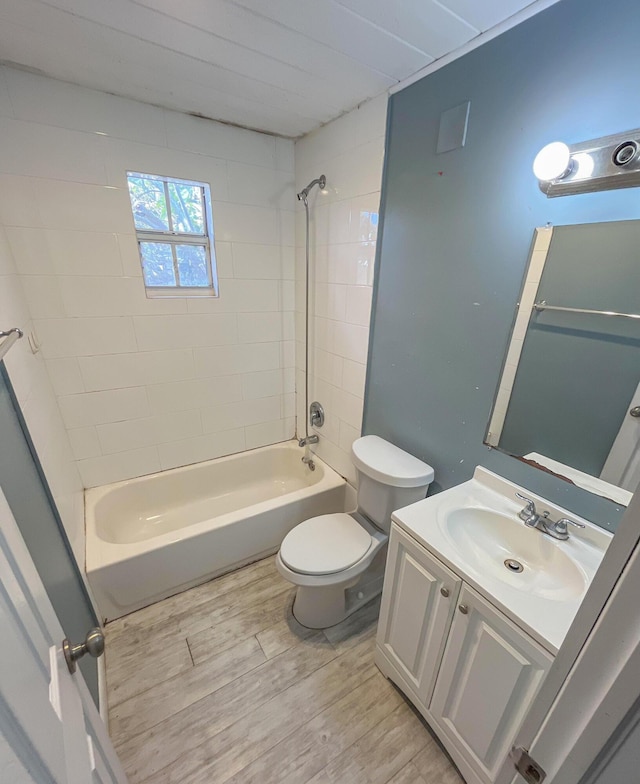 2818 Alabama St, West Palm Beach, FL 33406 - full bathroom featuring toilet, washtub / shower combination, vanity, and wood finished floors