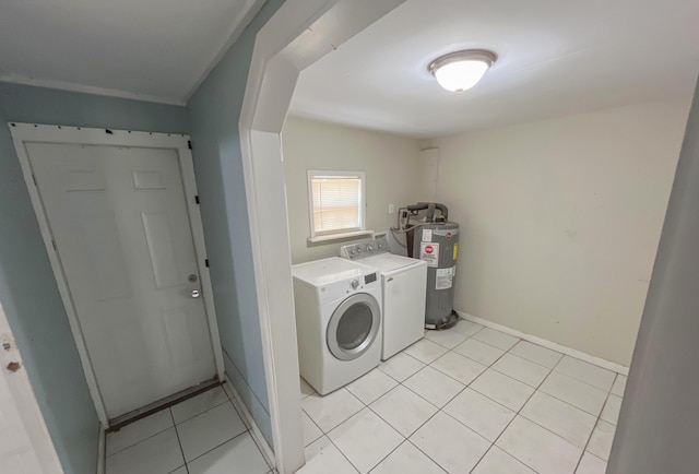 2818 Alabama St, West Palm Beach, FL 33406 - washroom featuring water heater, washer and clothes dryer, light tile patterned floors, and baseboards