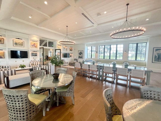 1130 Tangled Orchard Trce, The Acreage, FL 33470 - dining area featuring a chandelier, coffered ceiling, wood finished floors, recessed lighting, and beamed ceiling
