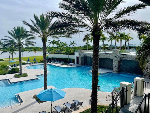 1130 Tangled Orchard Trce, The Acreage, FL 33470 - community pool featuring a patio