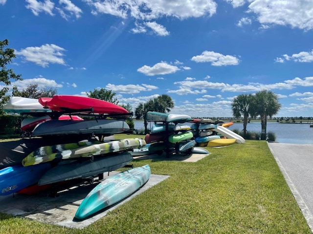 1130 Tangled Orchard Trce, The Acreage, FL 33470 - view of property's community with a water view and a yard