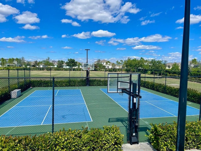 1130 Tangled Orchard Trce, The Acreage, FL 33470 - view of tennis court with community basketball court