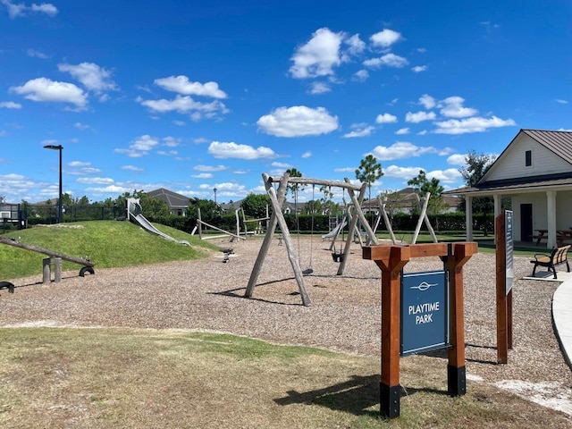 1130 Tangled Orchard Trce, The Acreage, FL 33470 - community play area with a lawn