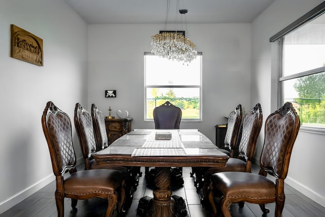 1130 Tangled Orchard Trce, The Acreage, FL 33470 - dining space featuring a chandelier, baseboards, and dark wood-style flooring