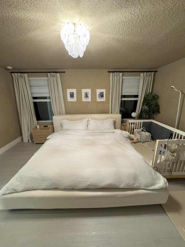 5700 Mentmore Dr, Mangonia Park, FL 33407 - bedroom with a textured ceiling and baseboards