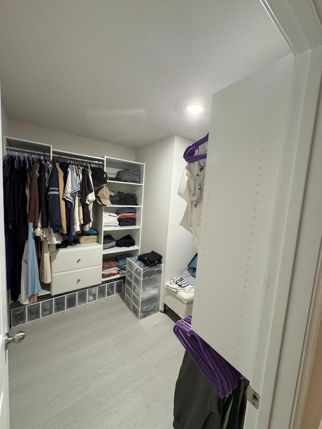 5700 Mentmore Dr, Mangonia Park, FL 33407 - spacious closet with wood finished floors