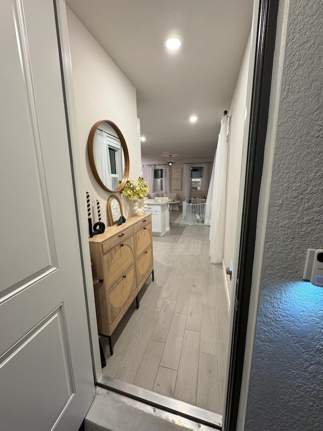 5700 Mentmore Dr, Mangonia Park, FL 33407 - corridor featuring light wood-type flooring and recessed lighting
