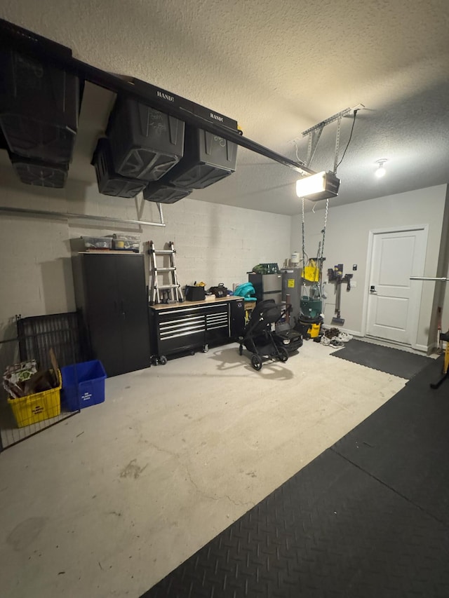 5700 Mentmore Dr, Mangonia Park, FL 33407 - garage featuring a garage door opener and electric water heater