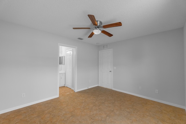 545 SW Buswell Ave, Port Saint Lucie, FL 34983 - empty room with ceiling fan, a textured ceiling, and baseboards
