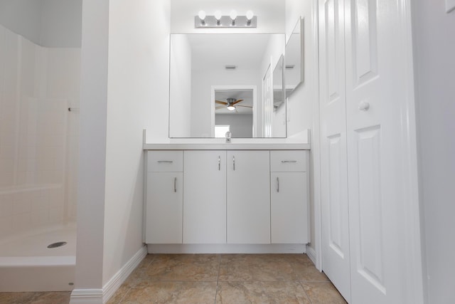545 SW Buswell Ave, Port Saint Lucie, FL 34983 - bathroom featuring a closet, vanity, ceiling fan, a shower, and baseboards