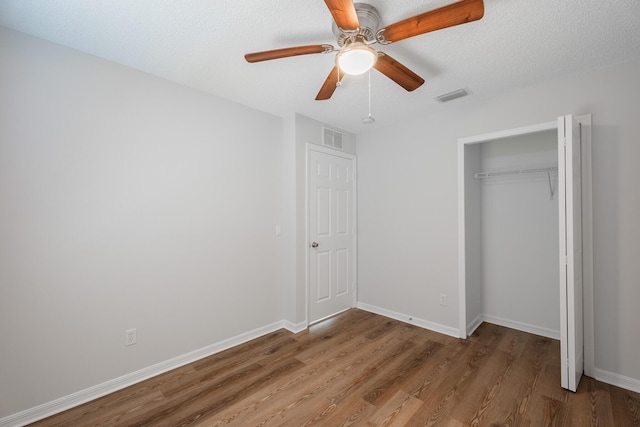 545 SW Buswell Ave, Port Saint Lucie, FL 34983 - unfurnished bedroom featuring light wood-style flooring, a closet, baseboards, and a ceiling fan