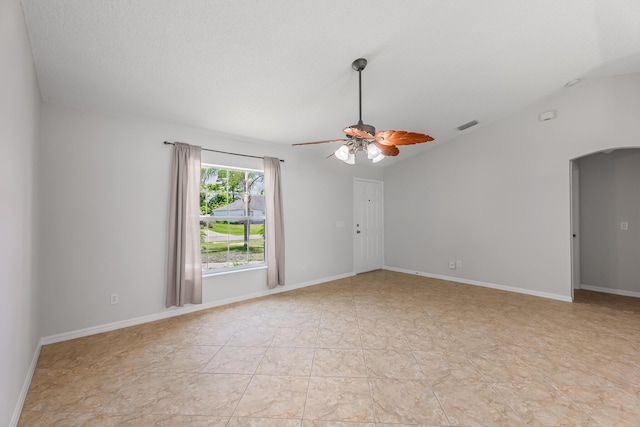 545 SW Buswell Ave, Port Saint Lucie, FL 34983 - unfurnished room featuring arched walkways, ceiling fan, lofted ceiling, and baseboards