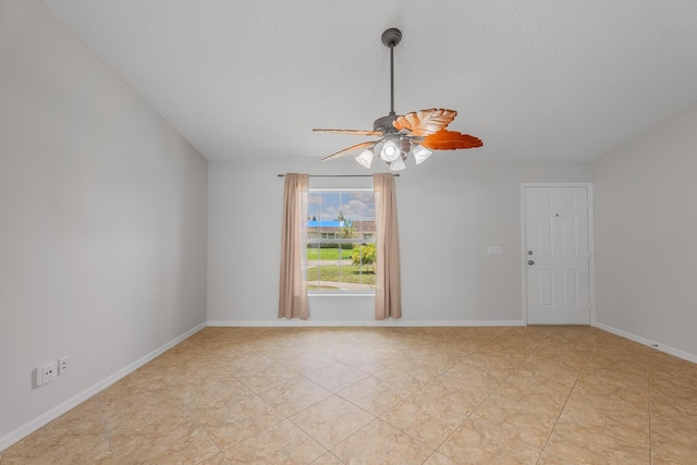 545 SW Buswell Ave, Port Saint Lucie, FL 34983 - spare room with ceiling fan, light tile patterned floors, and a textured ceiling
