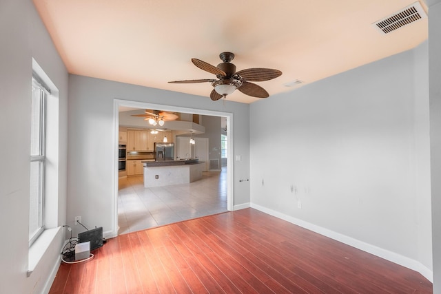 1501 SW Kamchatka Ave, Port Saint Lucie, FL 34953 - unfurnished room with a ceiling fan and light wood-type flooring