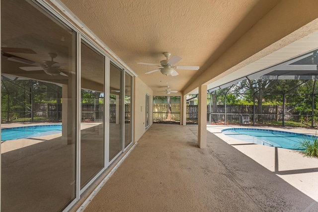 1501 SW Kamchatka Ave, Port Saint Lucie, FL 34953 - view of pool featuring a fenced backyard, ceiling fan, a patio area, and a lanai