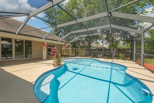 1501 SW Kamchatka Ave, Port Saint Lucie, FL 34953 - view of swimming pool with a fenced backyard, a patio area, and a lanai