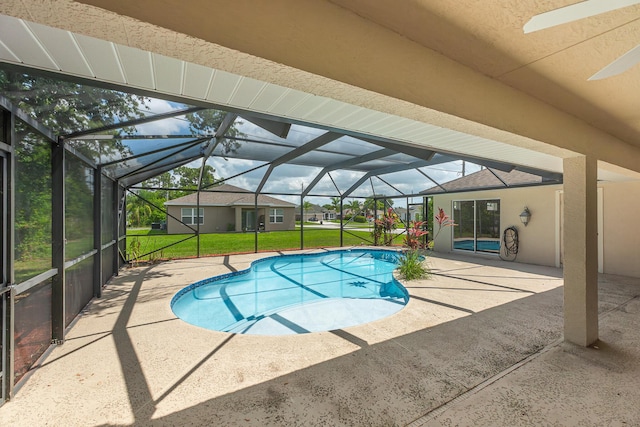 1501 SW Kamchatka Ave, Port Saint Lucie, FL 34953 - swimming pool with a lawn, a patio, and a lanai
