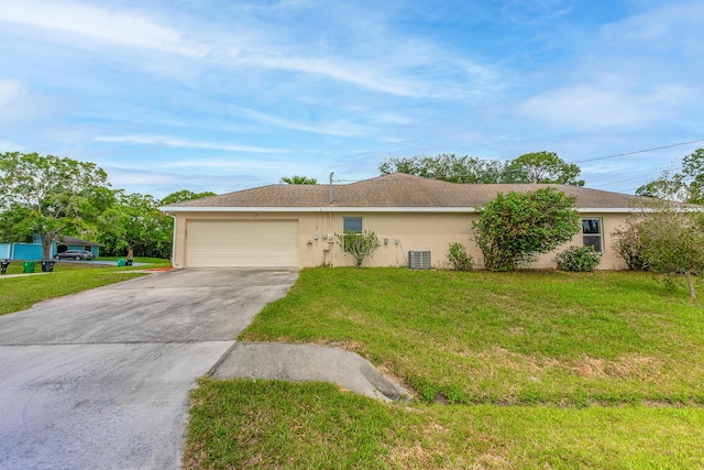 1501 SW Kamchatka Ave, Port Saint Lucie, FL 34953 - ranch-style house with a garage, driveway, a front yard, and stucco siding