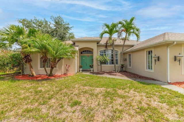 1501 SW Kamchatka Ave, Port Saint Lucie, FL 34953 - back of house featuring a yard and stucco siding