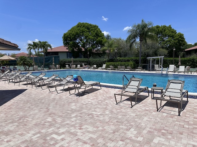 301 SW S River Dr Unit 206, Stuart, FL 34997 - community pool featuring a patio area