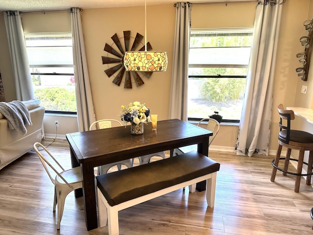 301 SW S River Dr Unit 206, Stuart, FL 34997 - dining space with light wood finished floors and baseboards