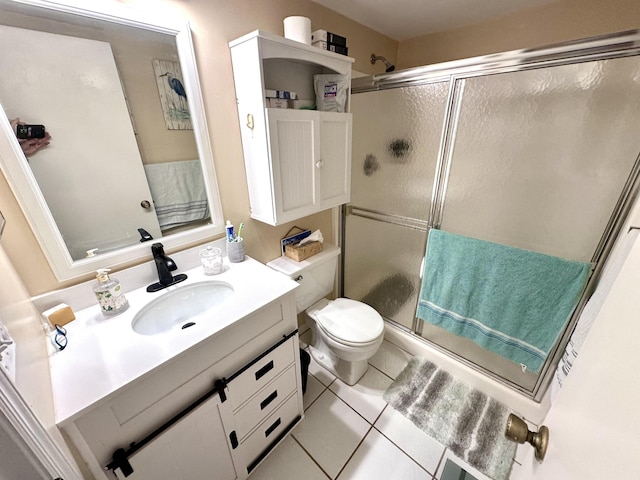 301 SW S River Dr Unit 206, Stuart, FL 34997 - full bath with a shower stall, vanity, toilet, and tile patterned flooring