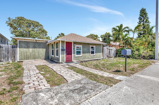 1112 S K St, Lake Worth Beach, FL 33460 - view of front facade with a shingled roof
