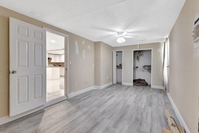 1112 S K St, Lake Worth Beach, FL 33460 - unfurnished bedroom with light wood-style flooring, baseboards, and ceiling fan