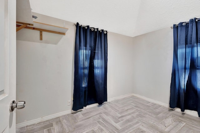 1112 S K St, Lake Worth Beach, FL 33460 - unfurnished room with baseboards and a textured ceiling