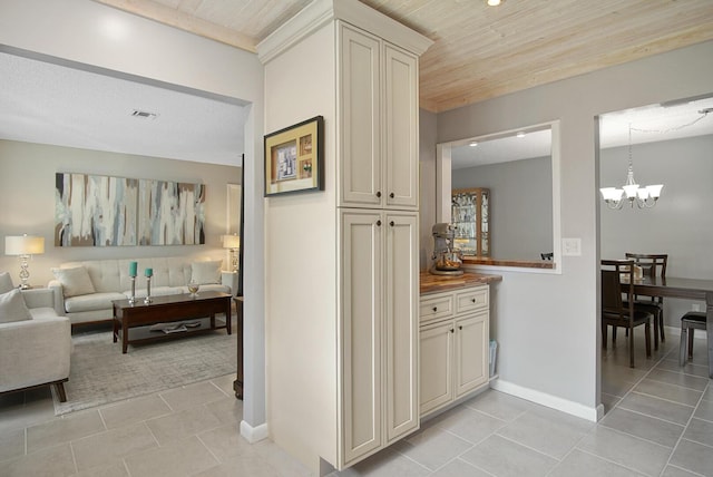 1233 S Lakes End Dr Unit A, Fort Pierce, FL 34982 - corridor featuring a chandelier, light tile patterned floors, wooden ceiling, and baseboards