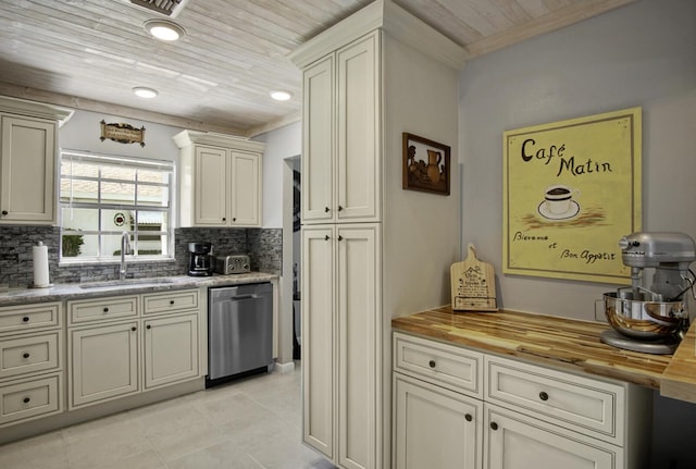 1233 S Lakes End Dr Unit A, Fort Pierce, FL 34982 - kitchen featuring stainless steel dishwasher, a sink, butcher block counters, decorative backsplash, and ornamental molding