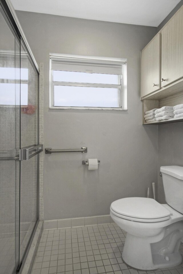 1233 S Lakes End Dr Unit A, Fort Pierce, FL 34982 - full bath with toilet, a shower stall, and tile patterned flooring