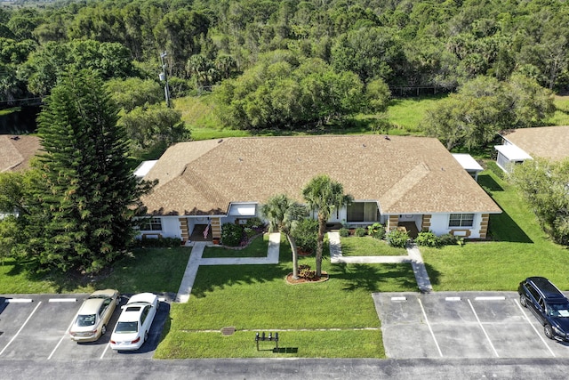 1233 S Lakes End Dr Unit A, Fort Pierce, FL 34982 - aerial view of property and surrounding area with a heavily wooded area