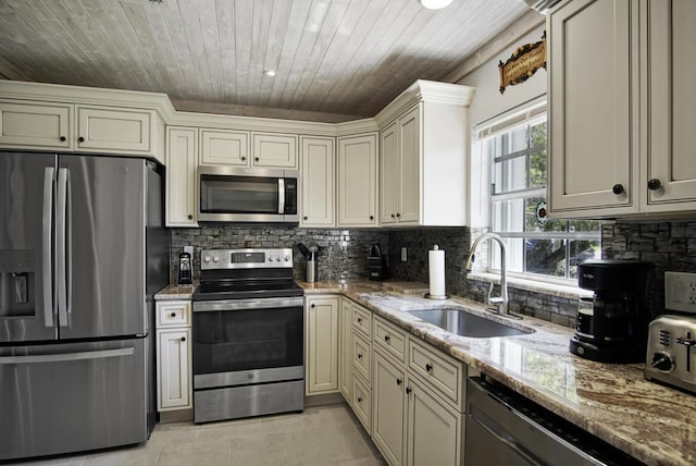 1233 S Lakes End Dr Unit A, Fort Pierce, FL 34982 - kitchen with stainless steel appliances, a sink, wooden ceiling, light tile patterned floors, and tasteful backsplash