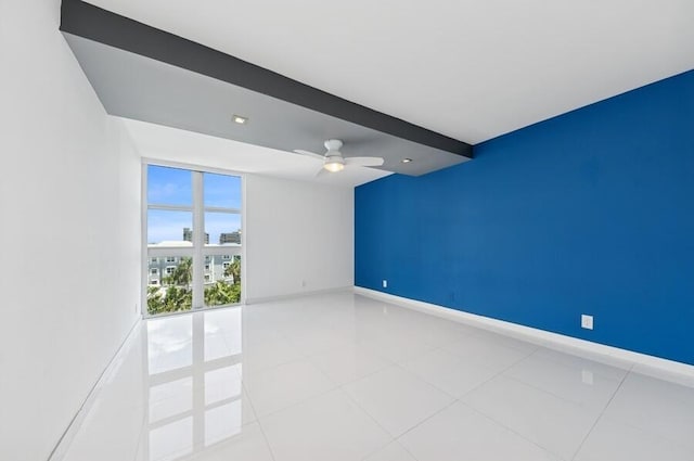 2200 S Ocean Blvd Unit 606, Delray Beach, FL 33483 - tiled empty room featuring ceiling fan and baseboards