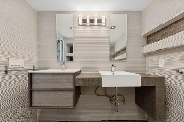 2200 S Ocean Blvd Unit 606, Delray Beach, FL 33483 - bathroom featuring a sink, tile walls, and tasteful backsplash