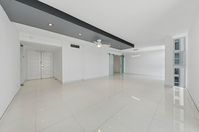2200 S Ocean Blvd Unit 606, Delray Beach, FL 33483 - spare room with a barn door, light tile patterned floors, baseboards, and recessed lighting