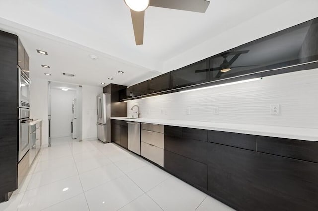 2200 S Ocean Blvd Unit 606, Delray Beach, FL 33483 - kitchen with a ceiling fan, modern cabinets, stainless steel appliances, and light countertops