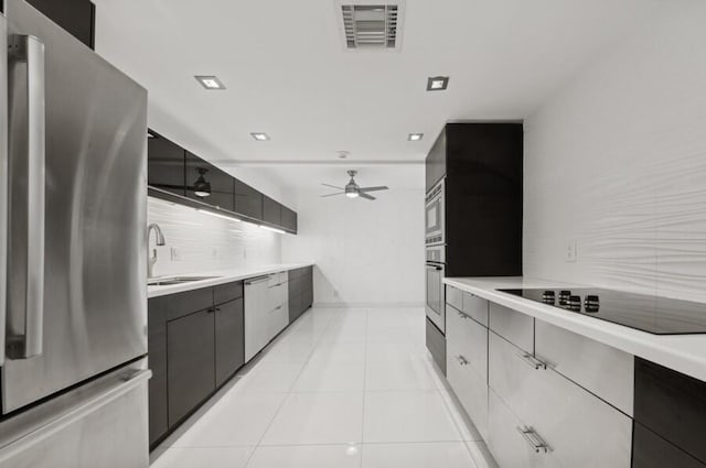 2200 S Ocean Blvd Unit 606, Delray Beach, FL 33483 - kitchen featuring stainless steel appliances, tasteful backsplash, a ceiling fan, and light countertops