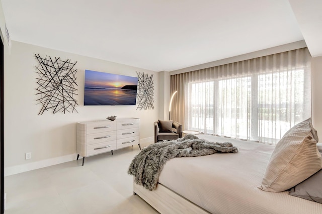 875 E Camino Real Unit 2G, Boca Raton, FL 33432 - bedroom featuring baseboards