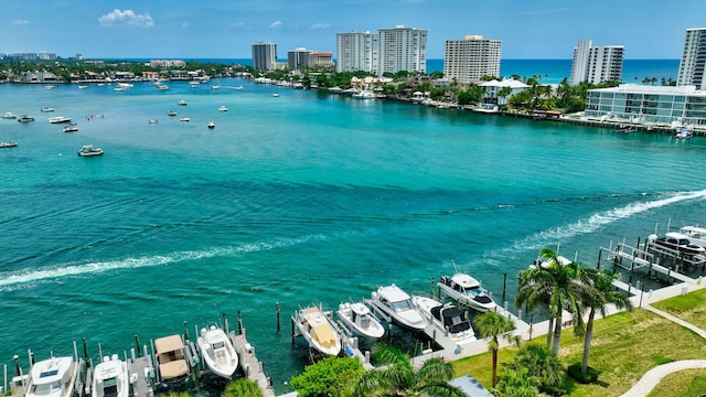 875 E Camino Real Unit 2G, Boca Raton, FL 33432 - water view featuring boat lift, a boat dock, and nearby urban area