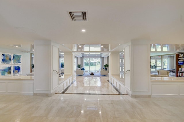 875 E Camino Real Unit 2G, Boca Raton, FL 33432 - corridor with a decorative wall and plenty of natural light