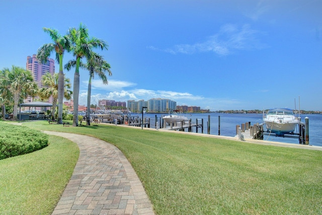 875 E Camino Real Unit 2G, Boca Raton, FL 33432 - dock area featuring a yard, boat lift, and a water view